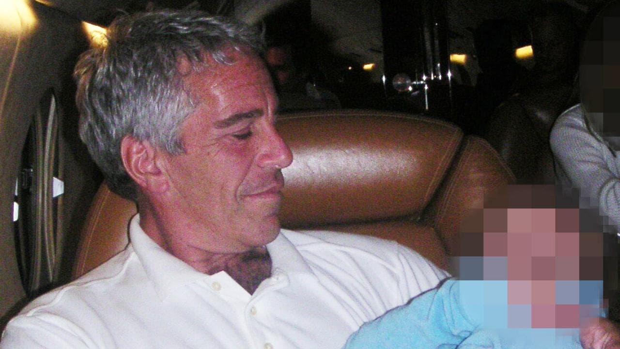 Image of paedophile hugging sleeping child on Lolita Express