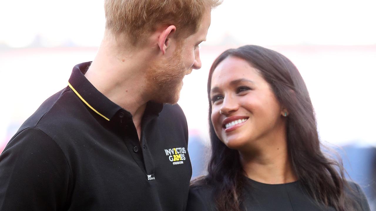 Sussexes touching Princess Diana tribute