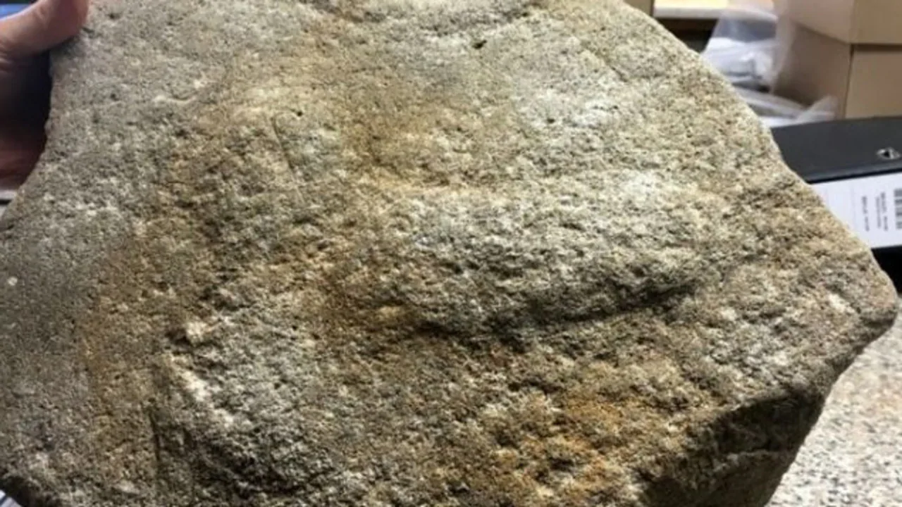 UK archaeologists unearth 2000-year-old penis engraving on millstone