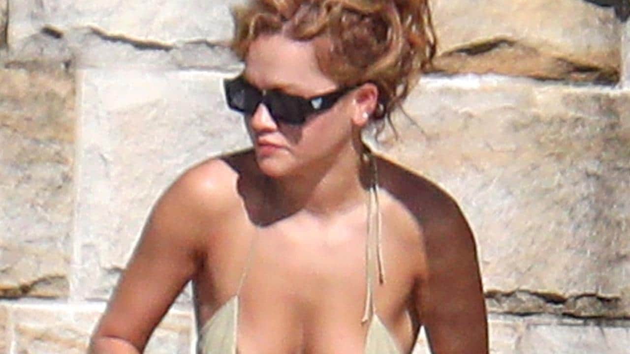 Rita Ora rocks a bikini as British singer sunbakes at Sydney mansion