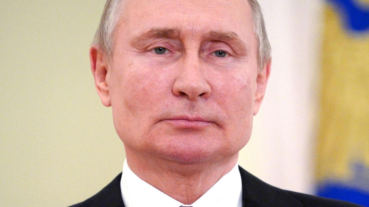 Vladimir Putin signs law letting him stay in office until 2036